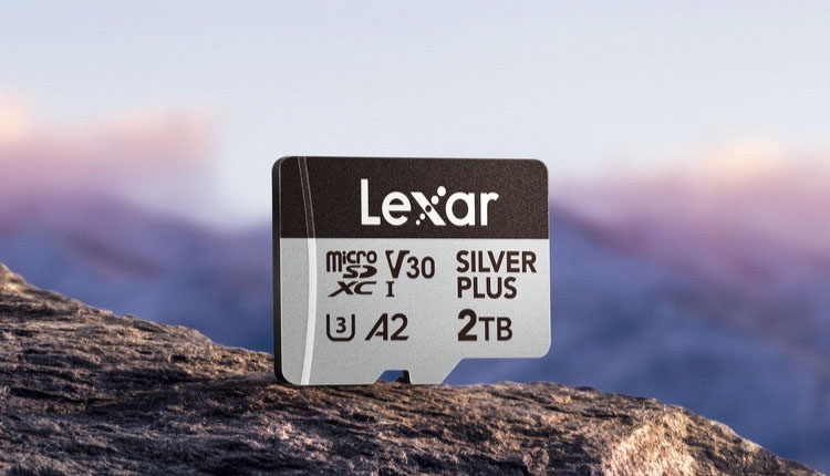 Lexar microSDXC V30 memory card, Silver Plus 2TB, on a rocky surface with a blurred mountain background.